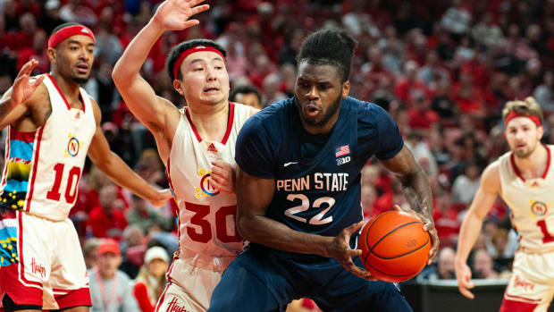 Feb 17, 2024; Lincoln, Nebraska, USA; Penn State Nittany Lions forward Qudus Wahab (22) drives against Nebraska Cornhuskers guard Keisei Tominaga (30) during the second half at Pinnacle Bank Arena.